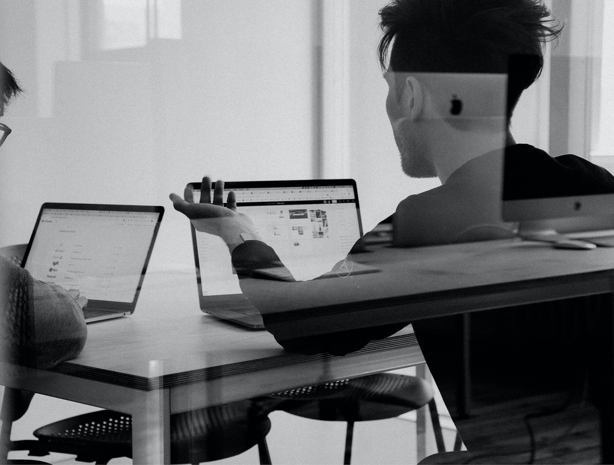 Two men working on a computer